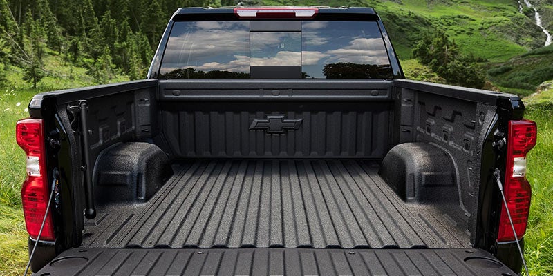 Chevrolet Silverado 1500 truck's back section highlighting key features.